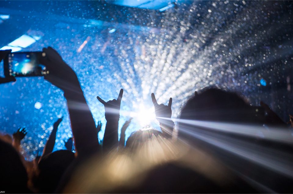 Metal horns in the crowd during a Motionless In White concert at Amos Southend in Charlotte, NC. Music photo blog by Lizzy Davis.